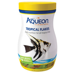 Aqueon copos de alimento tropical para peces, flotantes y fáciles de usar en la superficie.