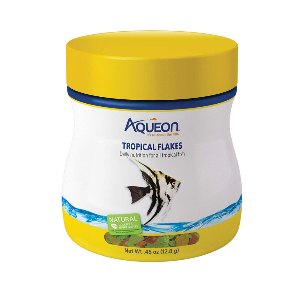 Aqueon Hojuelas Tropical flotando en la superficie, ideal para alimentación de superficie.