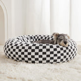 Cama donut de BFPETHOME para perros, diseño redondo y descanso cómodo.