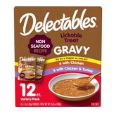 Delectables Hartz gravy lickable chicken-topper poured over kibble for moisture.