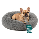 Cama Furhaven para perros con forma de rosquilla y soporte para la cabeza.