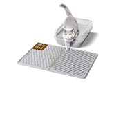 Kaxionage: alfombra para arena de gato con ranuras diagonales que capturan la arena