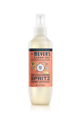 Mrs. Meyer's Clean Day cat deodorizing spray bottle refreshing a cat's coat.