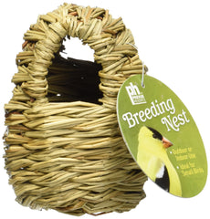 Prevue nido cubierto de ramitas dentro de jaula, fácil de colocar para aves pequeñas.