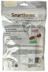 SmartBones Triple Flavor Dumbbells close-up shows peanut butter, chicken and beef flavors for dogs' tasty chewing.