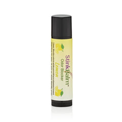 StinkBalm Citrus 911, etiqueta visible, aroma cítrico para espacios pequeños.