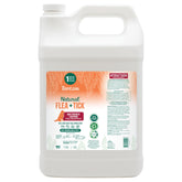 TropiClean Champú para perros, botella volcada, protege contra pulgas y garrapatas.