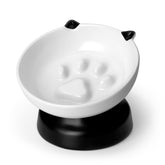 Vancasso comedero lento para gatos, cerámico y elevado, favorece postura cómoda al comer.