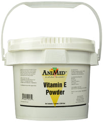 ANIMED vitamina E en polvo en bote, ideal para añadir a la comida de mascotas.