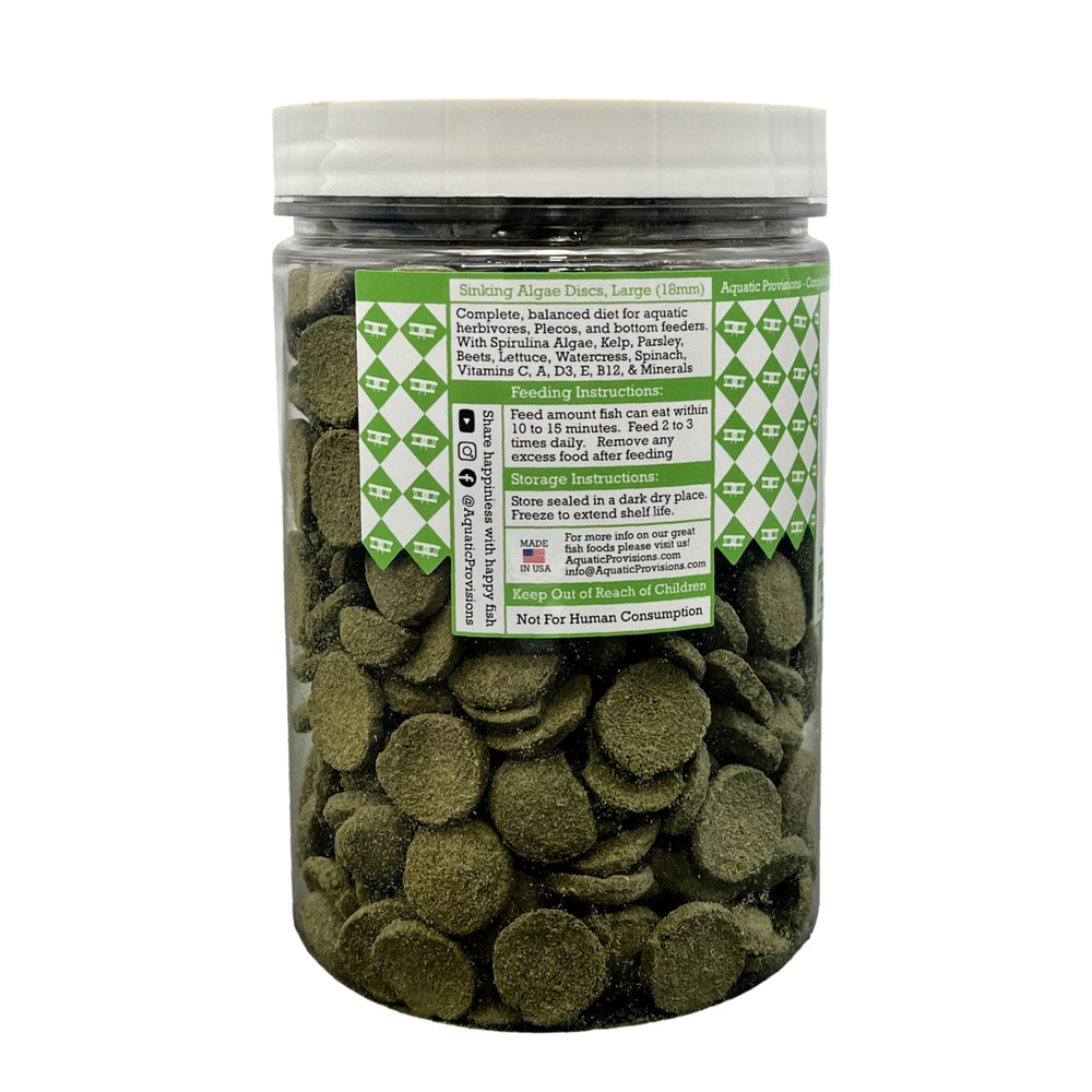Discos de algas Aquatic Provisions en un acuario, alimento para peces herbívoros de fondo.