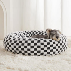 Cama donut de BFPETHOME para perros, diseño redondo y descanso cómodo.