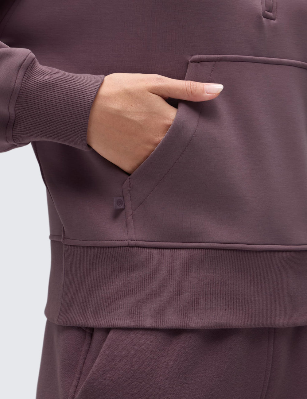 CRZ YOGA SoftAura: bolsillo canguro para guardar llaves o teléfono durante actividades.