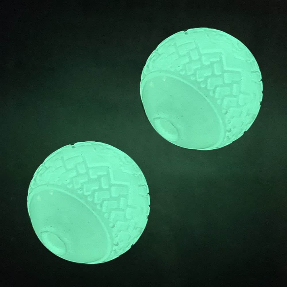 Pelota lumínica Feixun para perro brillando en la oscuridad, ideal para jugar de noche.
