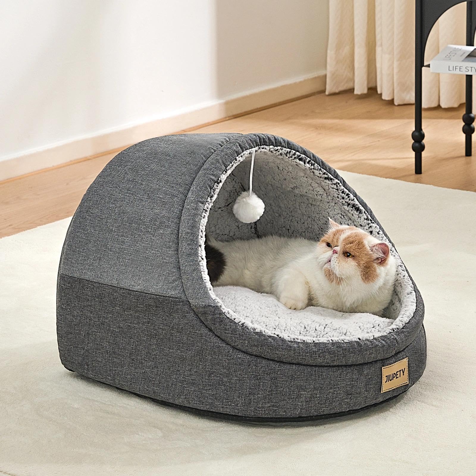 Jiupety-cama-gato-en-uso: ejemplo práctico de descanso en casa.