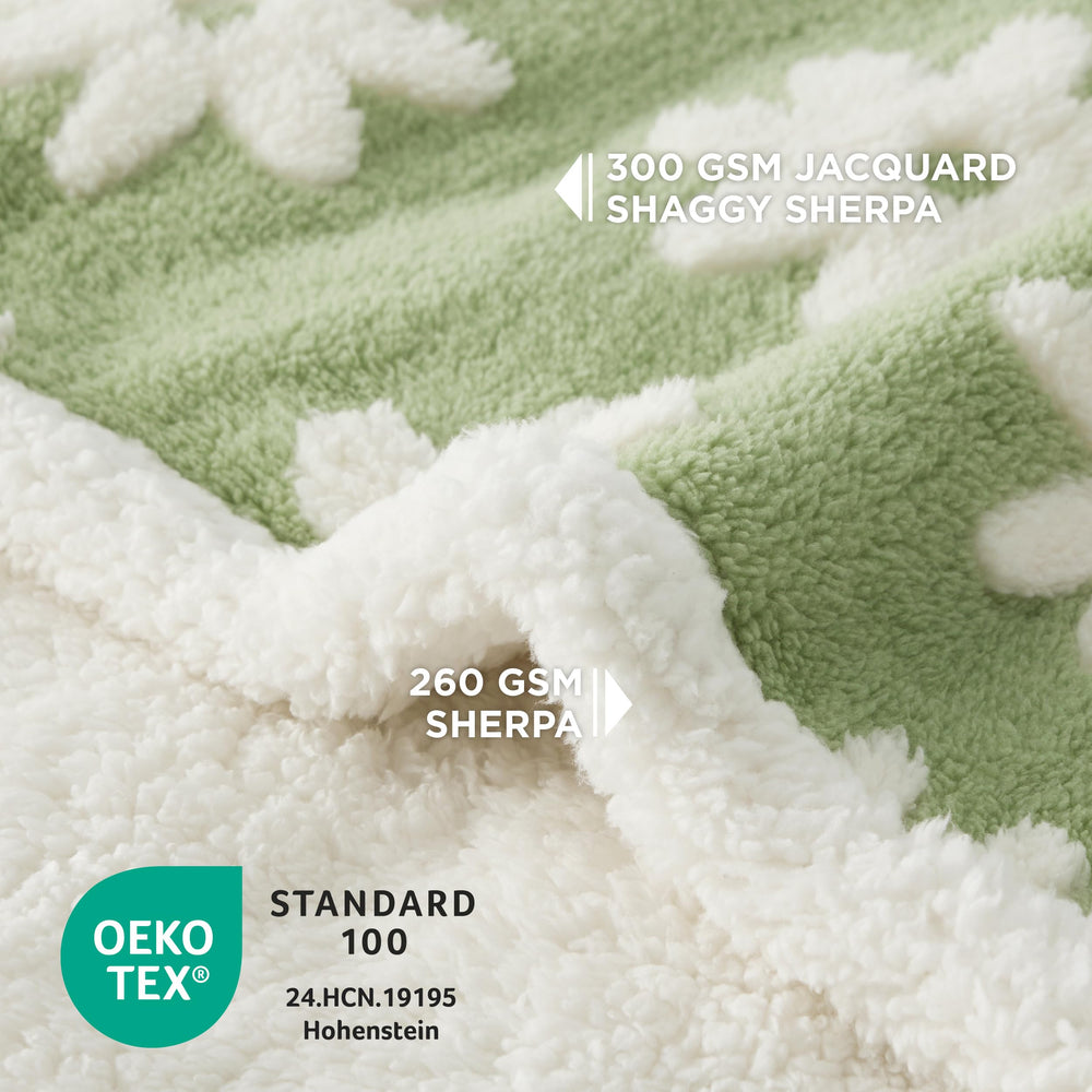 Manta LE SURE con tejido jacquard y textura nube 3D, estilo verde.