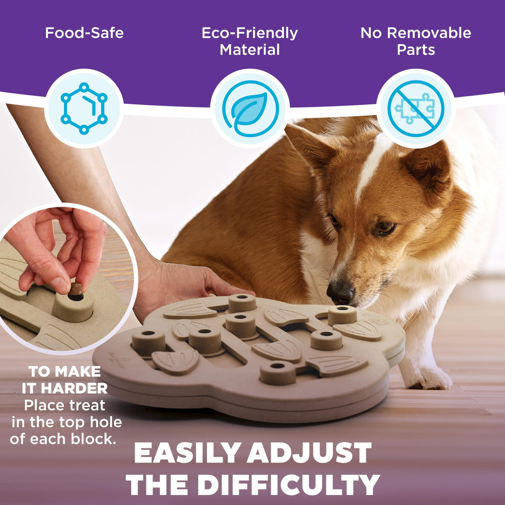 Outward Hound Dog Hide N' Slide: perro explorando el puzzle para mantenerlo activo.