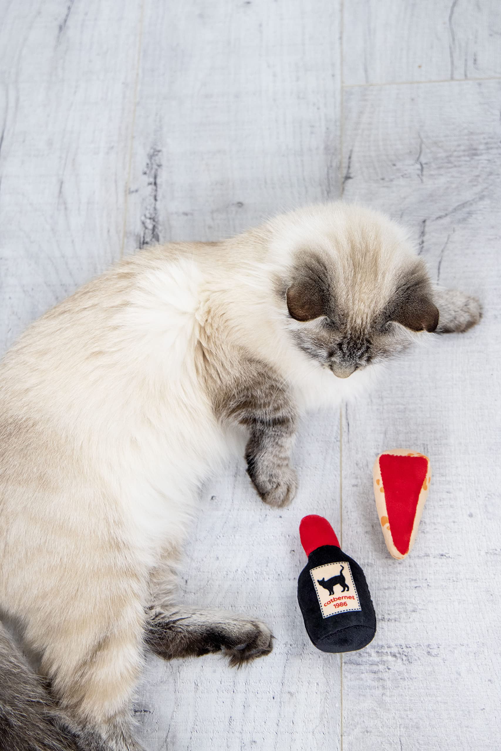 Pearhead juguete peluche: suaves texturas y bolsita de hierba gatera para jugar.