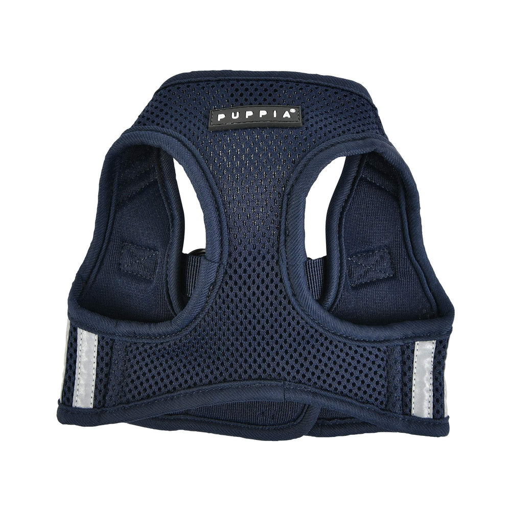 Detalles reflectantes del arnés Puppia Soft Vest Pro en azul marino para seguridad nocturna