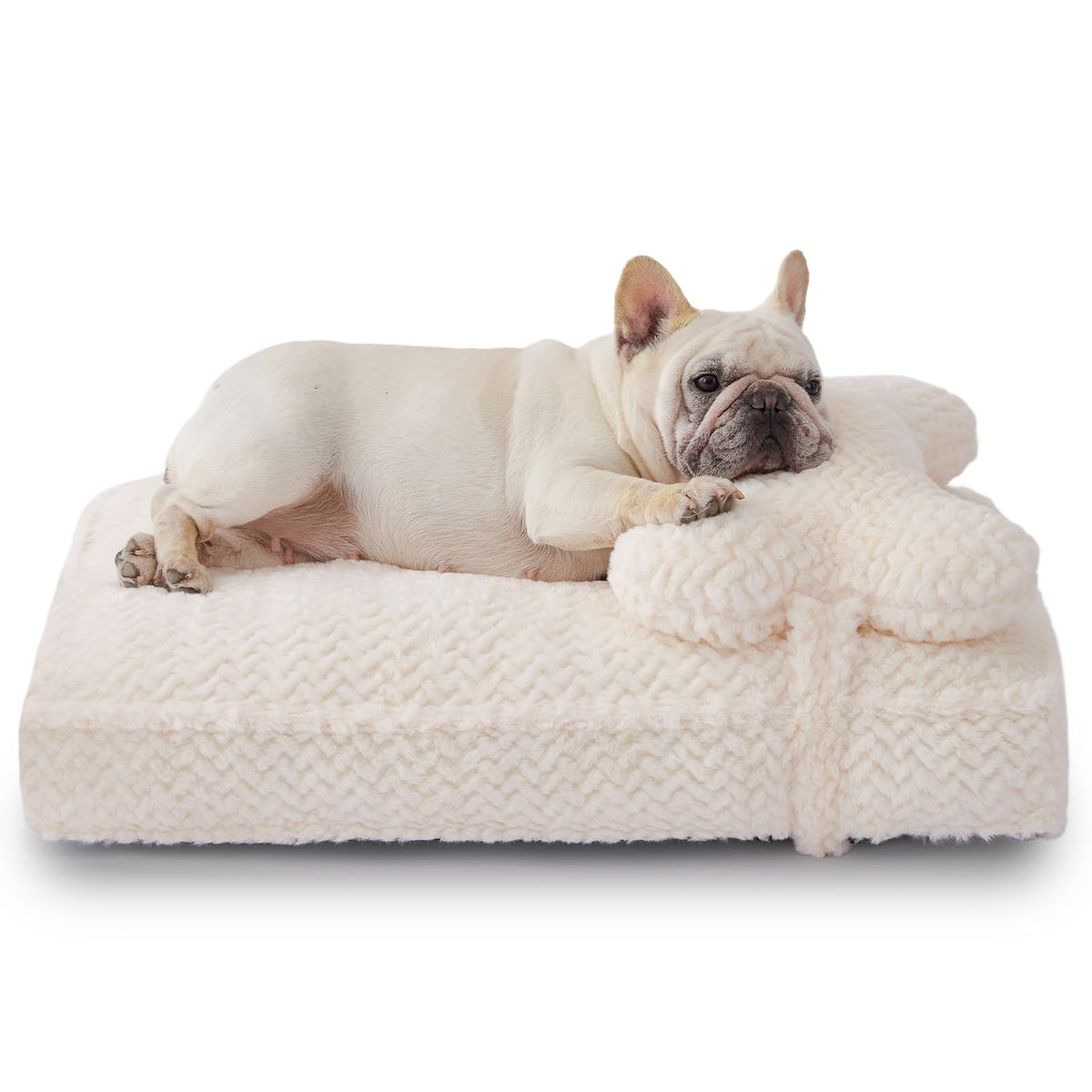Cama Soft Touch con pelo falso crema, superficie suave para descansar.