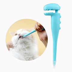 Lanzador TAOZUA para gatos con diseño de dinosaurio naranja facilita la administración de pastillas.