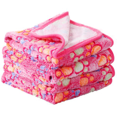 Tatuo couverture chien empreinte patte rose, douce et cocoonante.