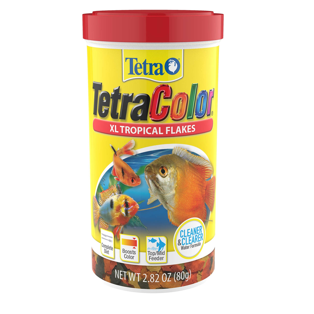 Copos de TetraColor Tropical Flakes se vierten para alimentar peces tropicales.
