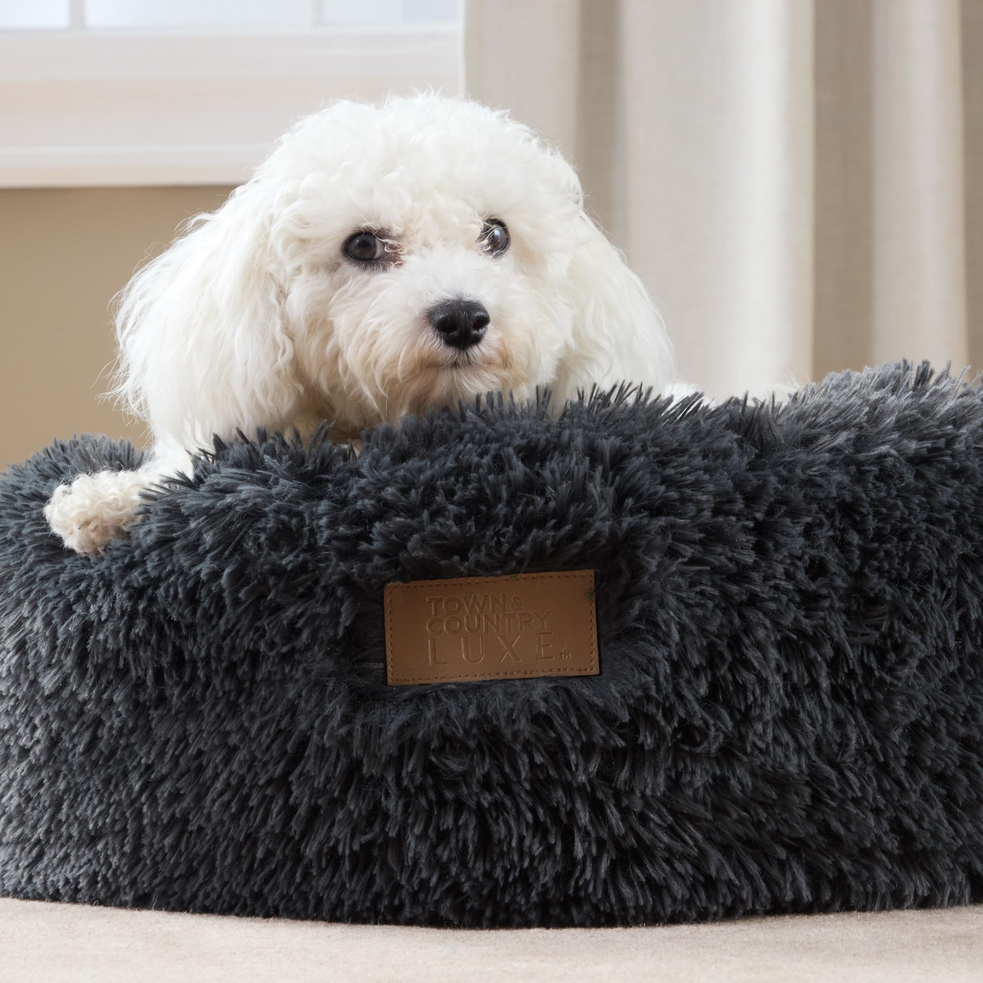 Forma redonda envolvente Town & Country Luxe CuddleTown para descanso seguro.