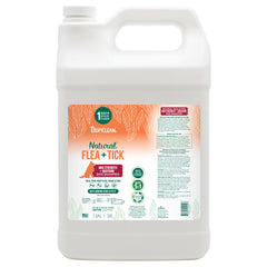 TropiClean Champú para perros, botella volcada, protege contra pulgas y garrapatas.