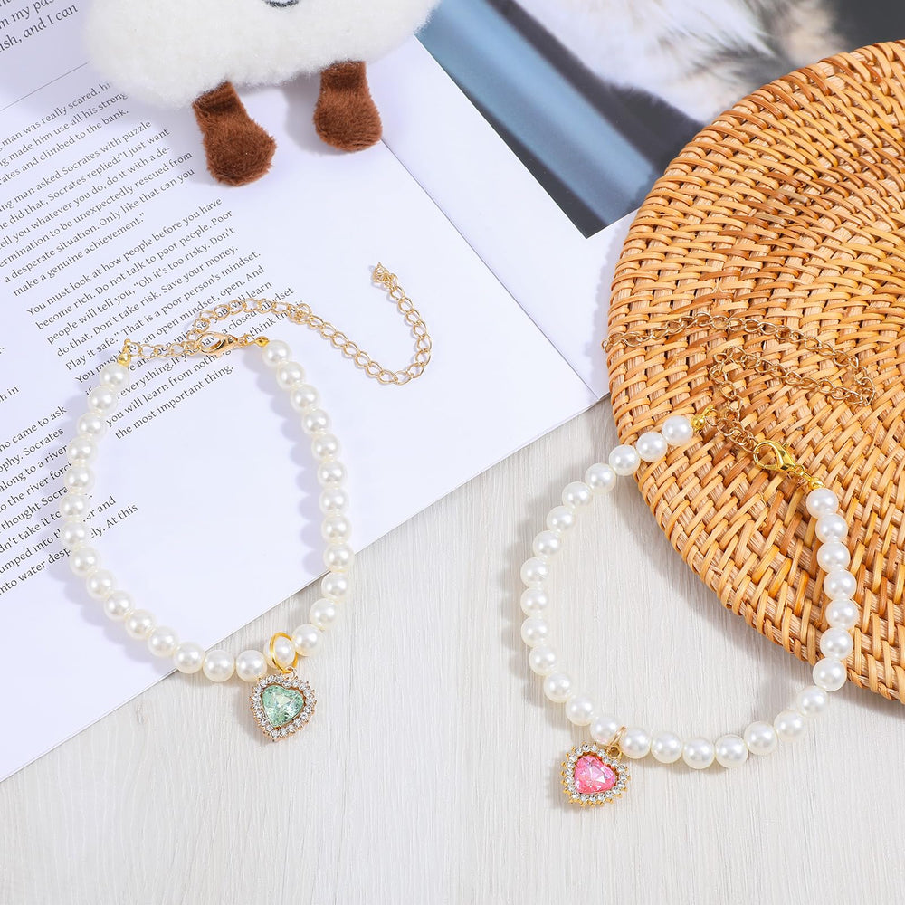 Tyqour collar de perlas con corazón rosa para gatos, ideal para fiestas y fotos.