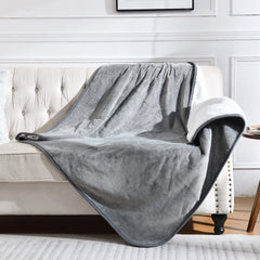 Manta Yaning impermeable dos caras protege cama y sofá ante derrames.